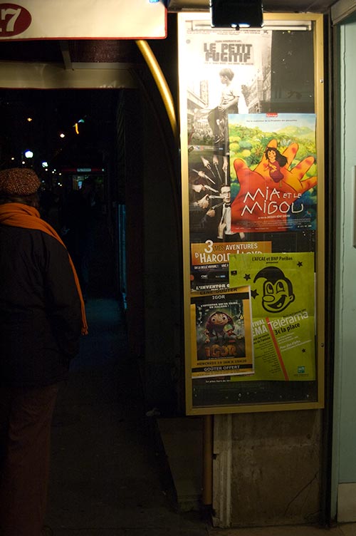 Paris night street scene with posters